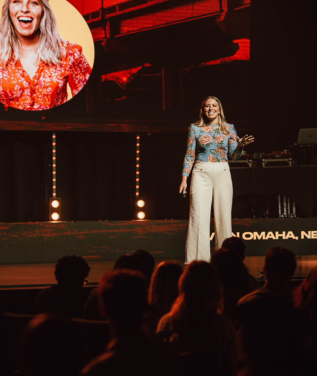 Jess speaking on stage