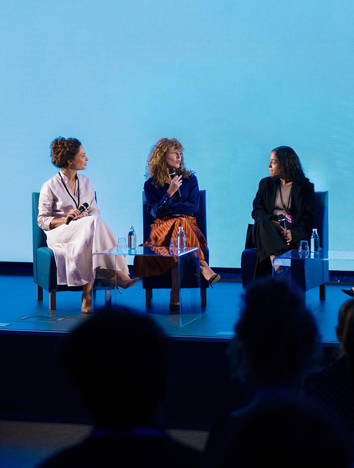 Women panelists on stage